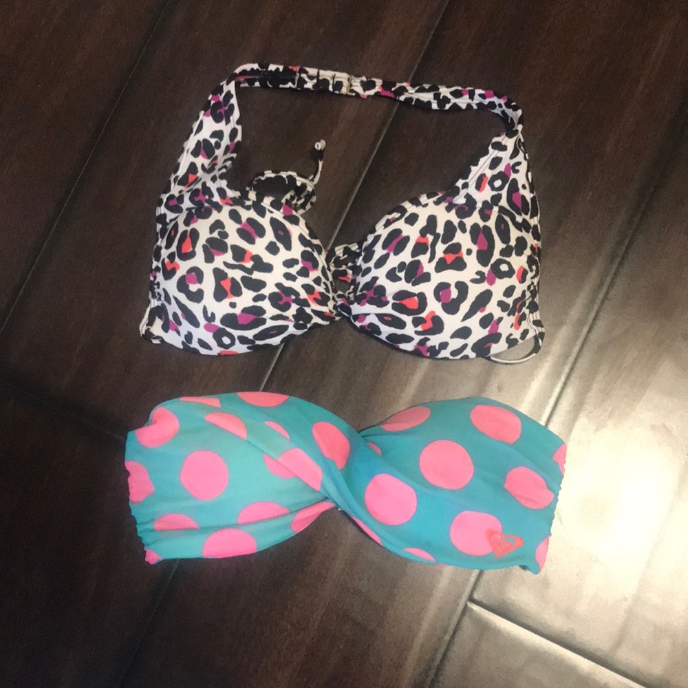Two swimsuit tops without bottoms.